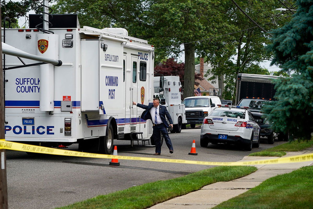 <i>John Minchillo/AP</i><br/>Authorities search Heuermann's home on July 18