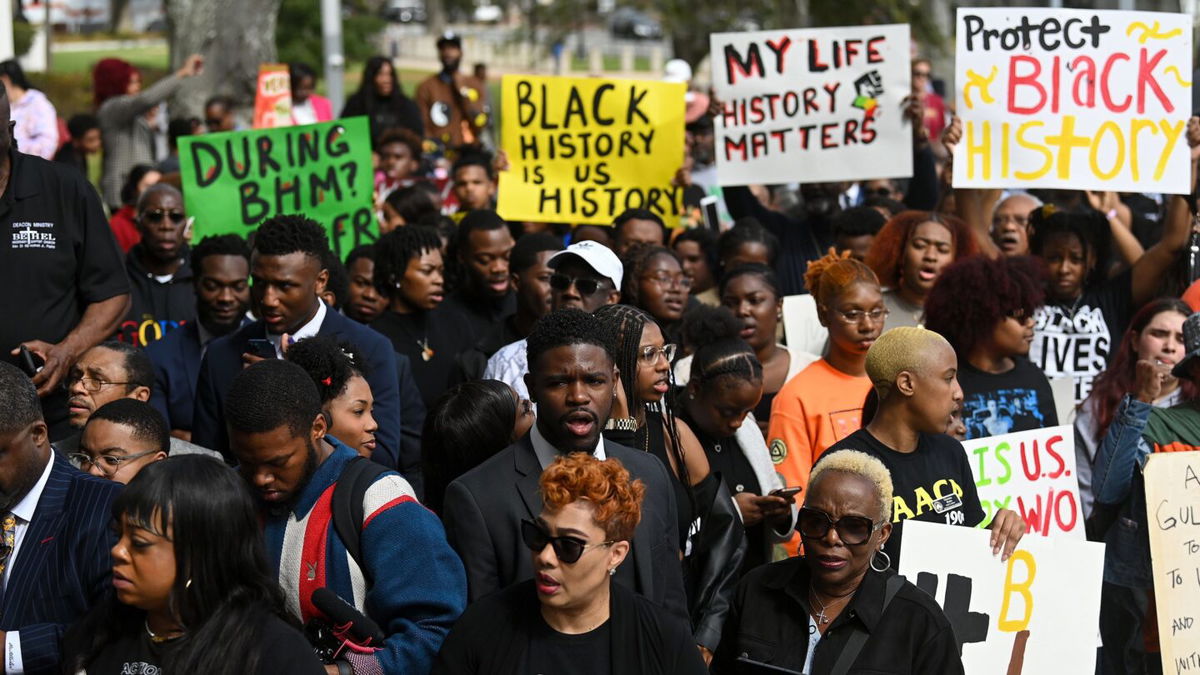 <i>Joshua Lott/The Washington Post/Getty Images</i><br/>Demonstrators protest Florida Gov. Ron DeSantis' plan to eliminate Advanced Placement courses on African American studies in high schools as they stand outside the Florida State Capitol in Tallahassee on February 15.