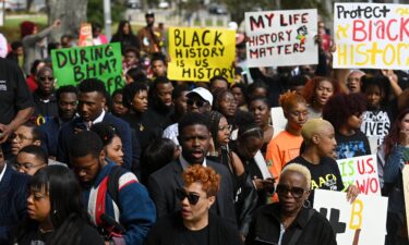 Demonstrators protest Florida Gov. Ron DeSantis' plan to eliminate Advanced Placement courses on African American studies in high schools as they stand outside the Florida State Capitol in Tallahassee on February 15.