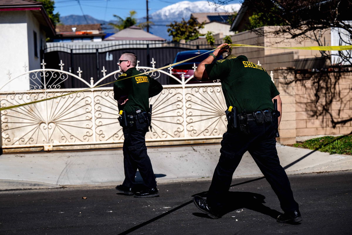 <i>Watchara Phomicinda/MediaNews Group/The Press-Enterprise/Getty Images</i><br/>San Bernardino County sheriff's investigators work the scene where three people were found dead in unincorporated San Bernardino County near Montclair