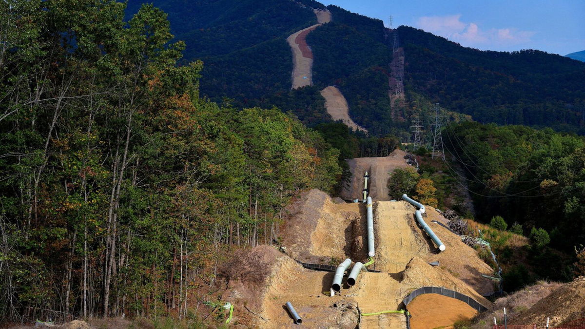 <i>Charles Mostoller/Reuters/File</i><br/>Lengths of pipe wait to be laid in the ground along the under-construction Mountain Valley Pipeline near Elliston