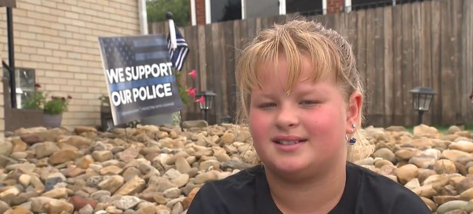 <i></i><br/>11-year-old Kaley Bastine is recognized for raising funds for police departments to help their K-9s with equipment and training