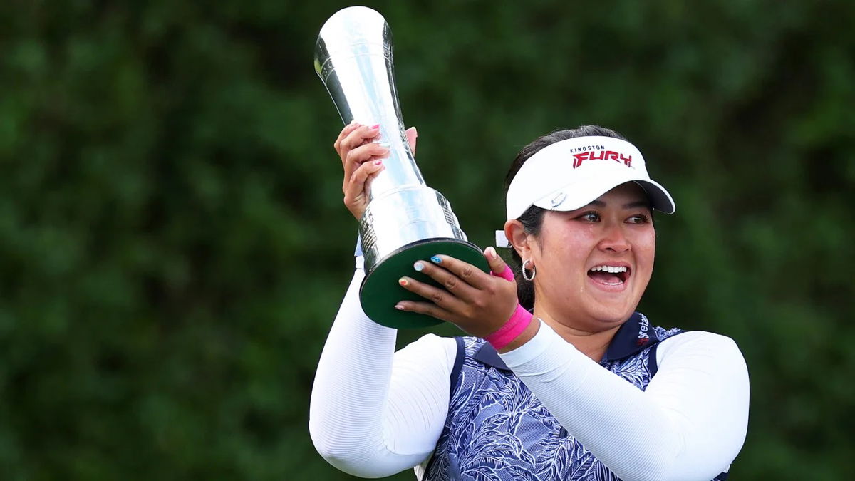 Lilia Vu lifts the AIG Women's Open Trophy at the Walton Heath Golf Club.