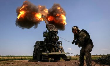 A Ukrainian serviceman of the 57th Kost Hordiienko Separate Motorised Infantry Brigade fires a 2S22 Bohdana self-propelled howitzer towards Russian troops