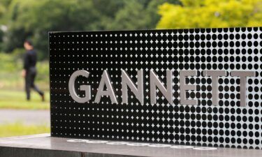 Newspaper chain Gannett has paused the use of an artificial intelligence tool to write high school sports dispatches. The logo of Gannett Co is seen outside their corporate headquarters in McLean
