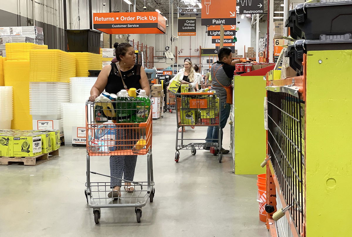 <i>Justin Sullivan/Getty Images</i><br/>Customers shop at a Home Depot store on July 25 in San Rafael