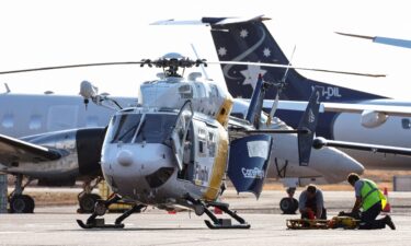 A Care Flight helicopter is seen on the tarmac of the Darwin International Airport in Darwin on August 27. Three US Marines died on August 27 after an Osprey aircraft crashed on a remote tropical island north of Australia during war games