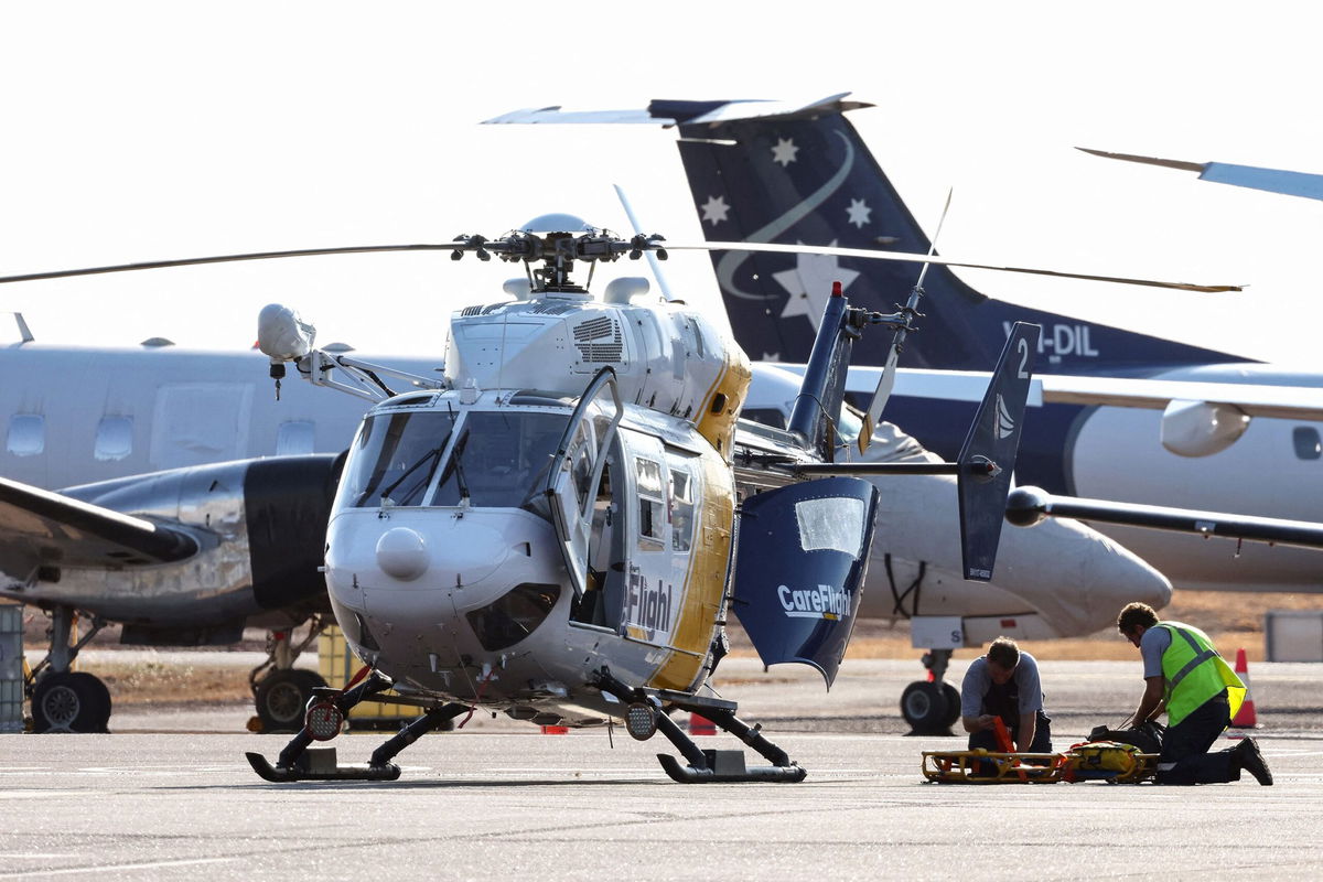 <i>David Gray/AFP/Getty Images</i><br/>A Care Flight helicopter is seen on the tarmac of the Darwin International Airport in Darwin on August 27. Three US Marines died on August 27 after an Osprey aircraft crashed on a remote tropical island north of Australia during war games