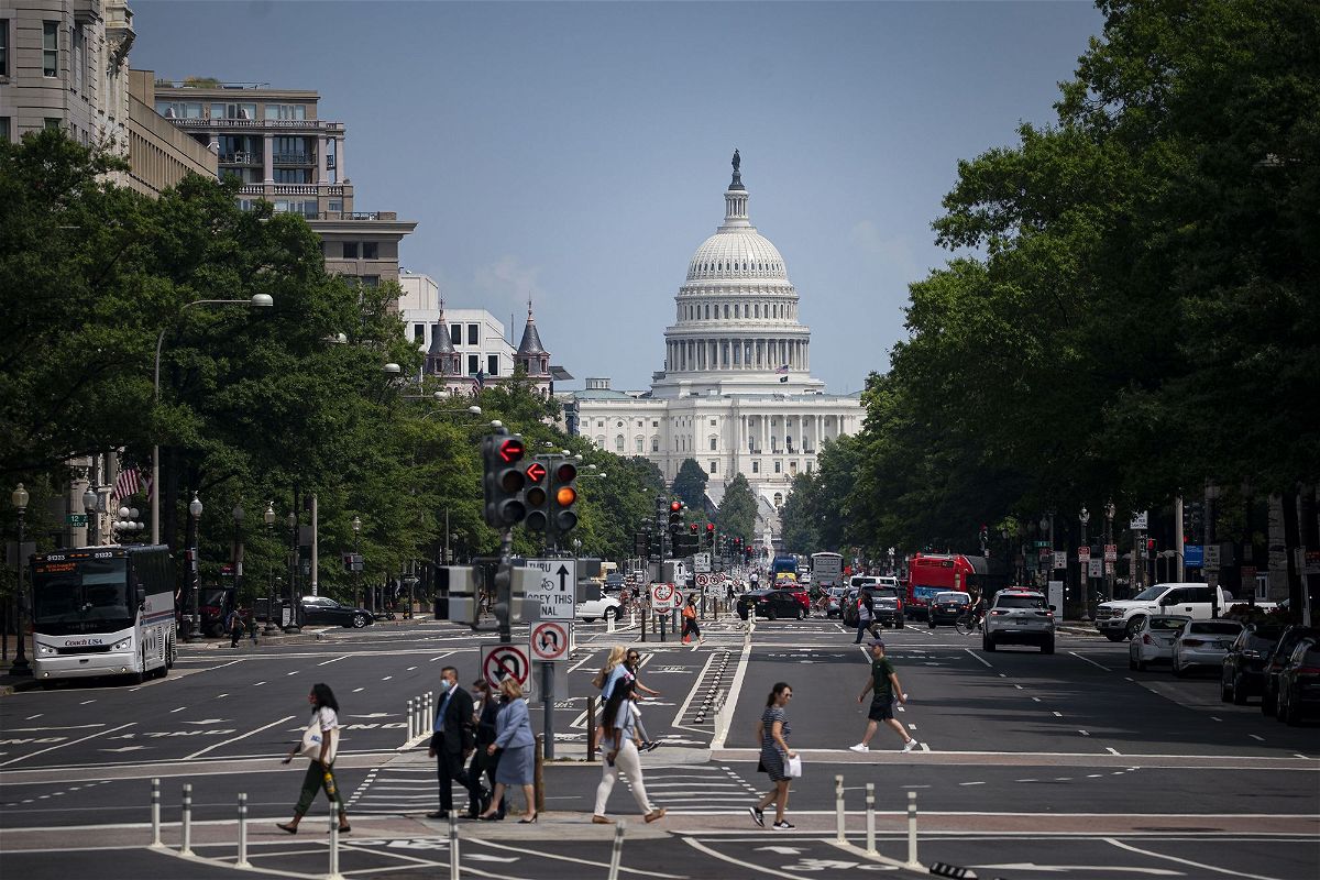 <i>Al Drago/Bloomberg/Getty Images</i><br/>Pedestrians cross a street near the U.S. Capitol in Washington
