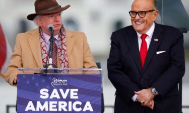 Attorney John Eastman (left) speaks next to former President Trump's personal attorney Rudy Giuliani