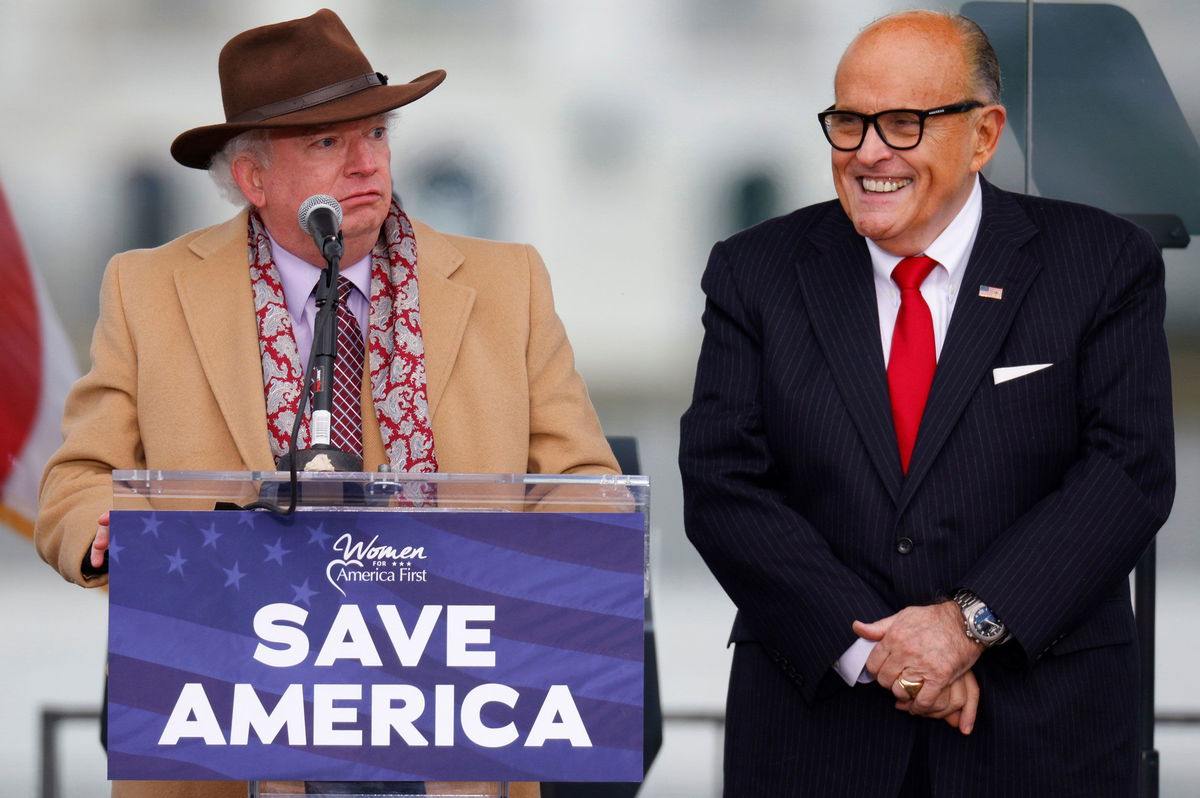 <i>Jim Bourg/Reuters/FILE</i><br/>Attorney John Eastman (left) speaks next to former President Trump's personal attorney Rudy Giuliani