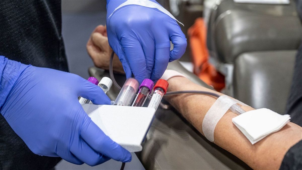 <i>Paul Bersebach/Orange County Register/Getty Images</i><br/>A nurse fills test tubes with blood to be tested during an American Red Cross bloodmobile in Fullerton