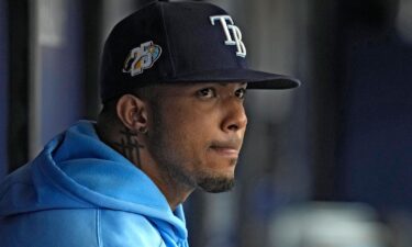 Wander Franco watches from the dugout during the fifth inning of the Tampa Bay Rays' game against the Cleveland Guardians on Sunday