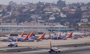 Southwest Airlines planes are shown at San Diego International Airport in a May 2023 file photo. A pilot who nearly landed a private jet on top of a commercial jetliner apparently noticed the other plane still on the runway