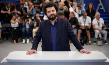 Director Saeed Roustaee poses for photographers at Cannes International Film Festival on May 26