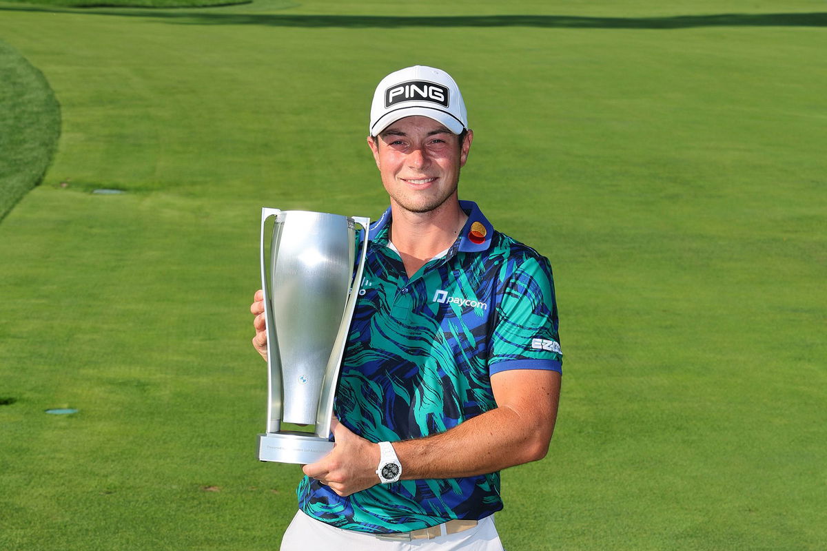 <i>Michael Reaves/Getty Images</i><br/>Viktor Hovland poses with the trophy after winning the BMW Championship at Olympia Fields Country Club in Illinois.