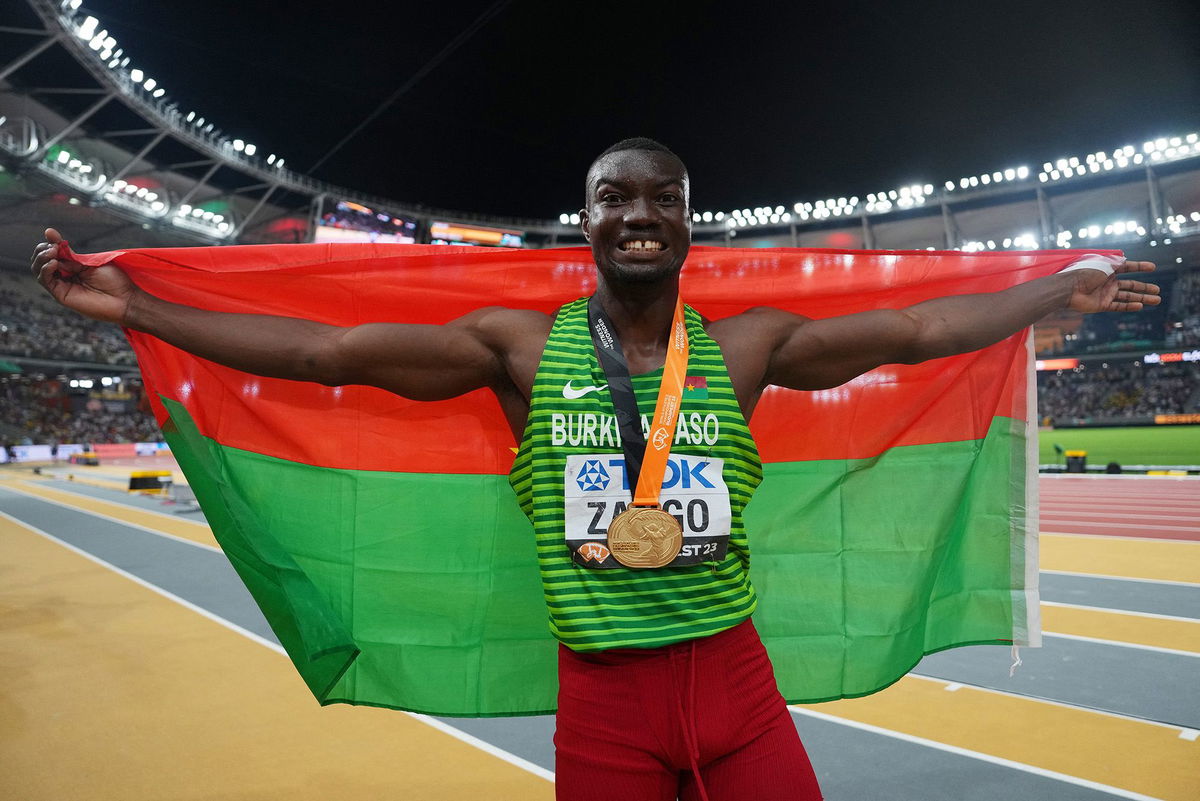 <i>Aleksandra Szmigiel/Reuters</i><br/>Hugues Fabrice Zango celebrates winning the triple jump gold medal on Monday.