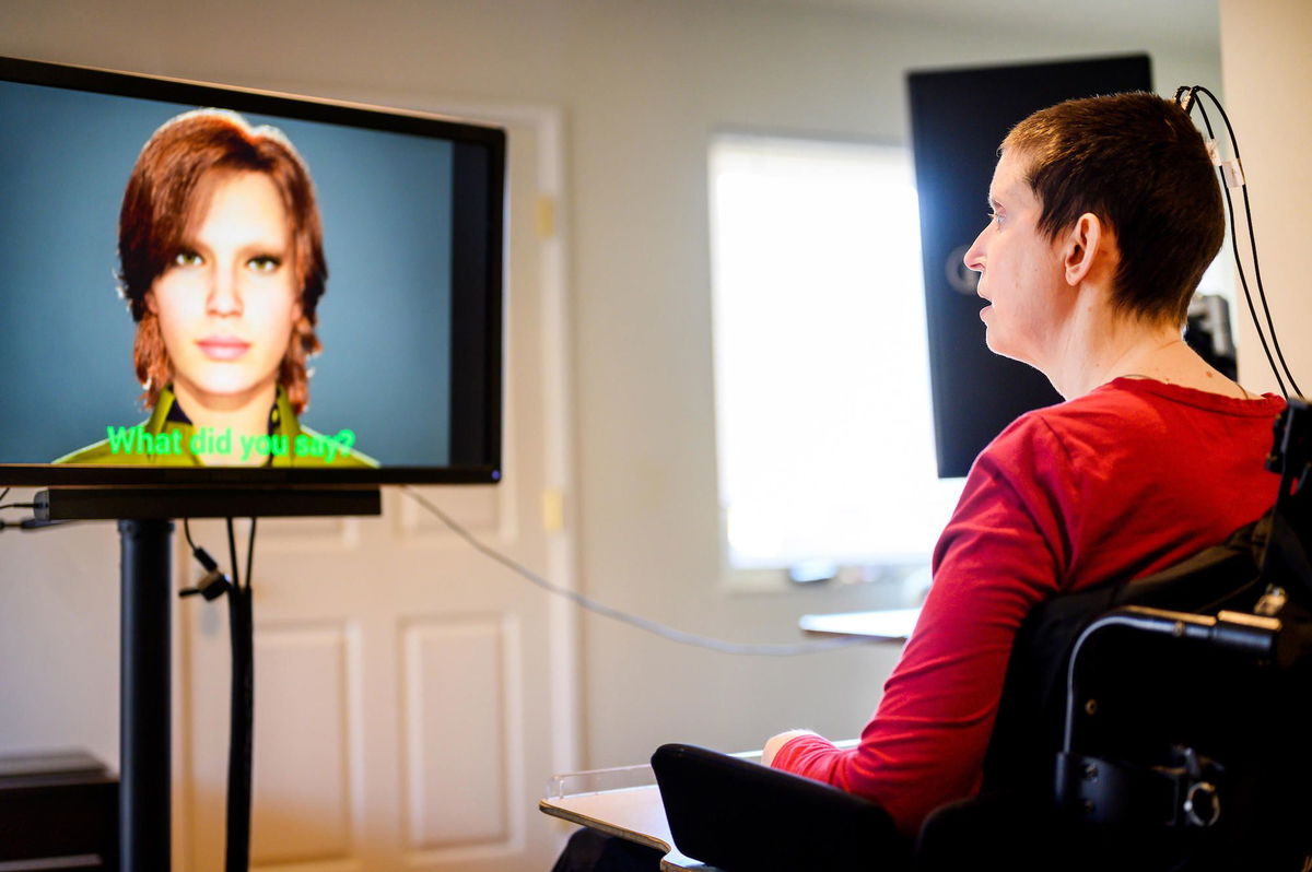 <i>Noah Berger/UCSF</i><br/>A participant in a study of speech neuroprostheses uses a digital link wired to her cortex to interface with an avatar.