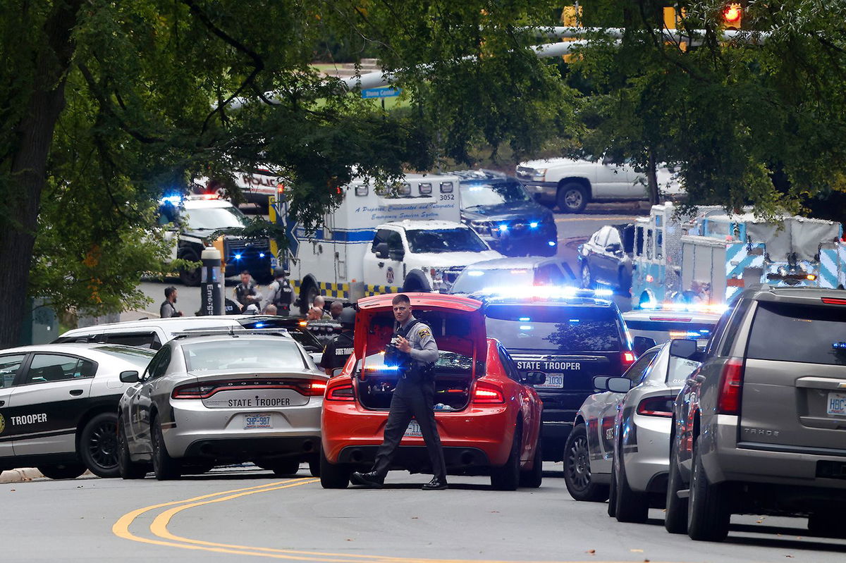 <i>Kaitlin McKeown/AP</i><br/>Emergency responders gather on South Street near the Bell Tower on the University of North Carolina at Chapel Hill campus on Monday.