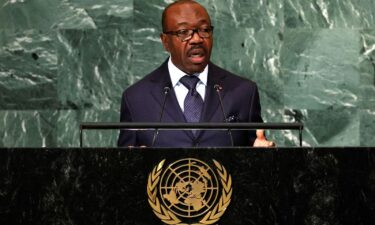 Gabon residents applaud members of the security forces in the Plein Ciel district Libreville on August 30.