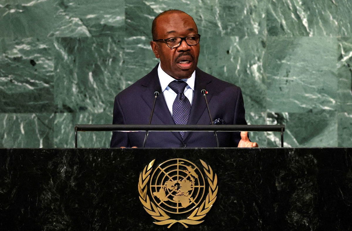 <i>AFP/Getty Images</i><br/>Gabon residents applaud members of the security forces in the Plein Ciel district Libreville on August 30.