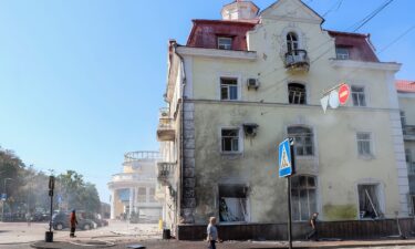 Rescuers work at a site of a Russian missile strike