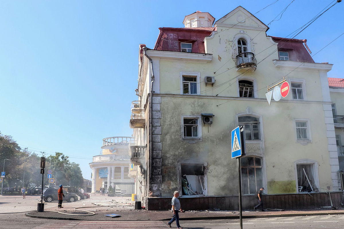 <i>National Police/Reuters</i><br/>Rescuers work at a site of a Russian missile strike