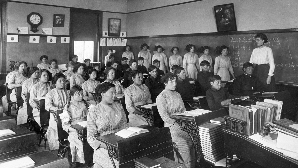 <i>National Archives via AP</i><br/>Fourth-grade students sit in a classroom at the former Genoa Indian Industrial School in Genoa