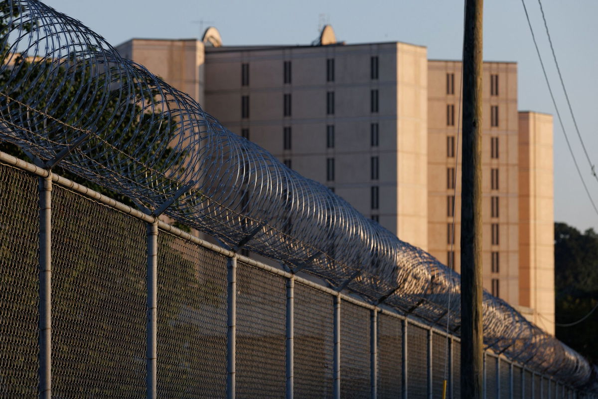 <i>Dustin Chambers/Reuters</i><br/>Razor wire lines the outside of the Fulton County Jail after a Grand Jury brought back indictments against former President Donald Trump and 18 of his allies in their attempt to overturn the state's 2020 election results in Atlanta