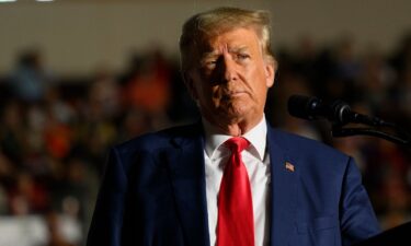 Former U.S. President Donald Trump speaks to supporters during a political rally while campaigning for the GOP nomination in the 2024 election.