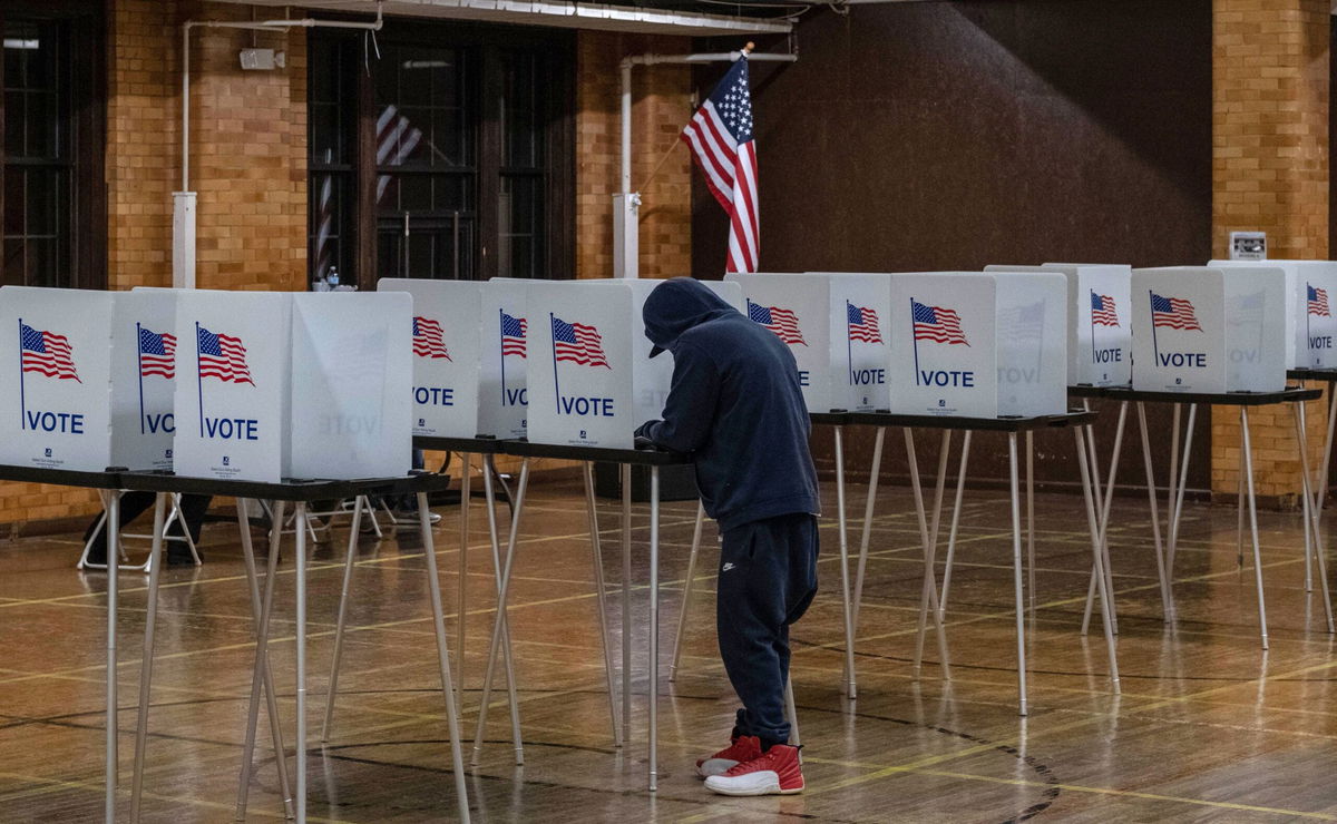 <i>Seth Herald/AFP/Getty Images</i><br/>A resident casts his vote on November 3