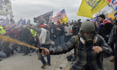 Riot police push back a crowd of supporters o President Donald Trump after they stormed the Capitol building on January 6