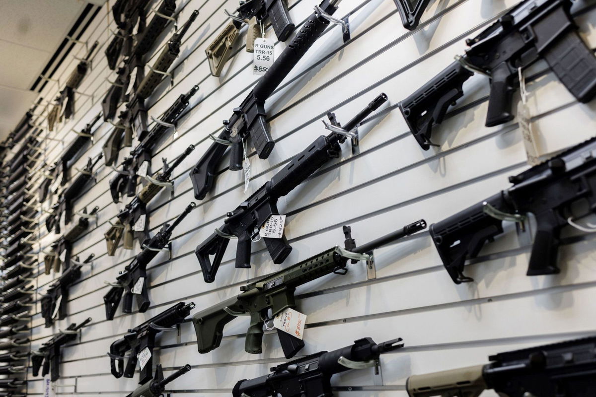 <i>Armando L. Sanchez/Chicago Tribune/Tribune News Service/Getty Images</i><br/>A selection of AR-15-style rifles hangs on a wall at a firearms store on January 11 in Carpentersville