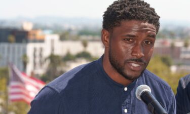 Former USC football player Reggie Bush speaks at a news conference announcing a defamation lawsuit against the NCAA at the Los Angeles Memorial Coliseum.