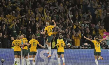 Australian players celebrate the team's opening goal against Denmark at the Women's World Cup.