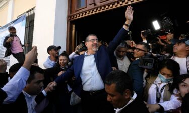 Presidential candidate Bernardo Arévalo waves after voting in Guatemala City