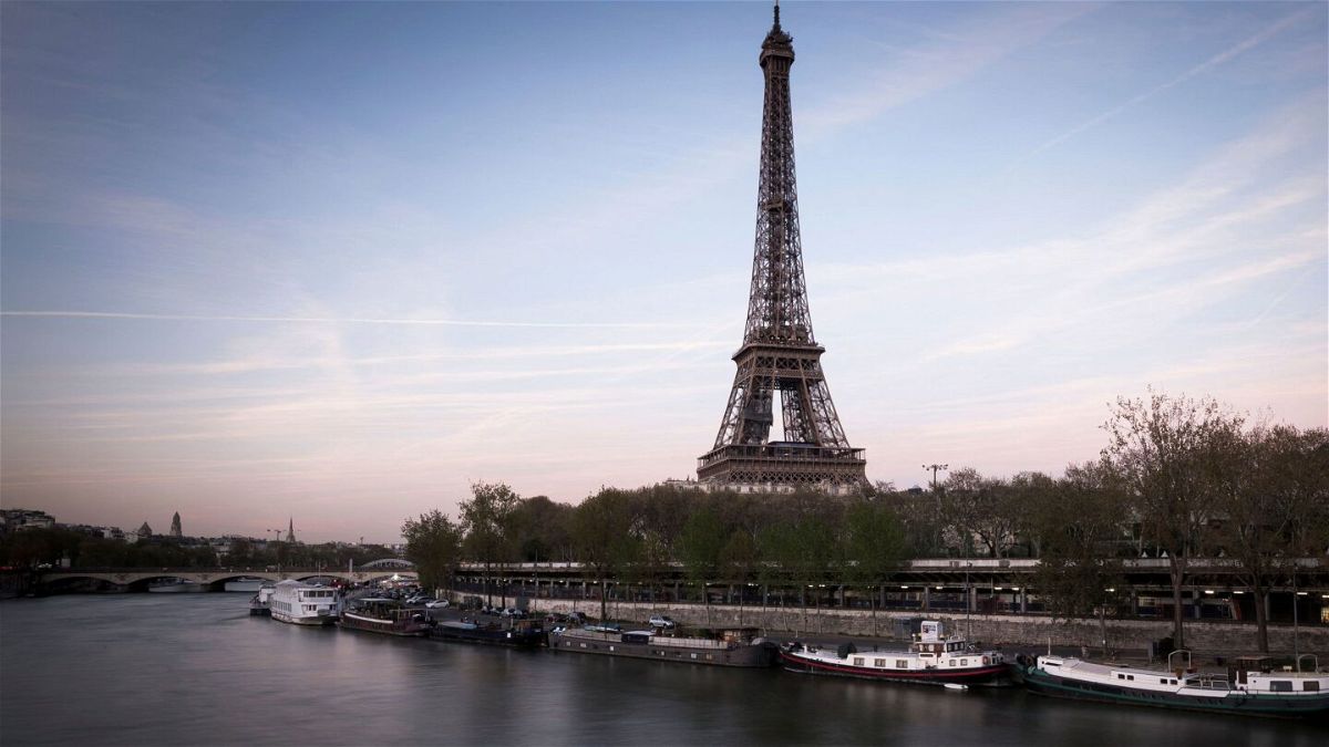 <i>Lionel Bonaventure/AFP via Getty Images</i><br/>Two American tourists spent the night up the Eiffel Tower on Monday