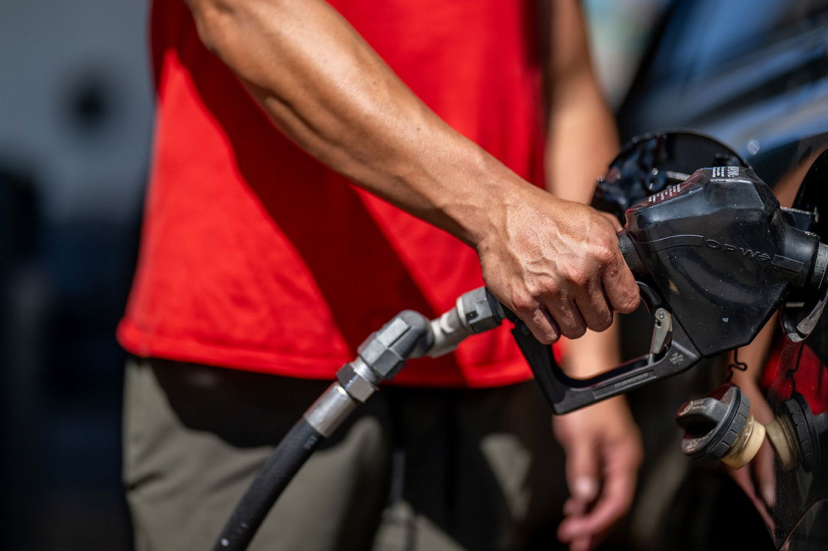 <i>Brandon Bell/Getty Images</i><br/>A person pumps gas at a Shell gas station on August 3 in Austin