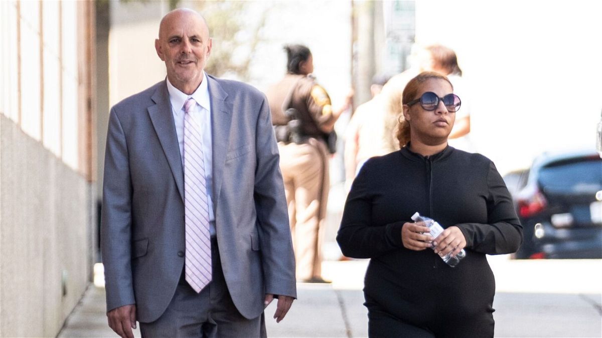 <i>Billy Schuerman/Daily Press/Tribune News Service/Getty Images</i><br/>Deja Taylor arrives with attorney James Ellenson at the Newport News Sheriff's Office in April.