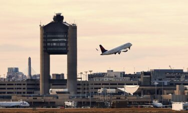 This screen capture from a jump-seat occupant's video shows the Learjet passing in front of the JetBlue plane at Boston Logan International Airport in February.