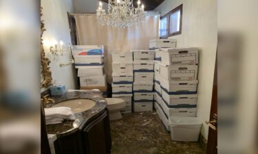 Boxes of documents are stored inside a bathroom and shower inside the Mar-a-Lago Club's Lake Room in this photo included in Donald Trump's federal indictment.