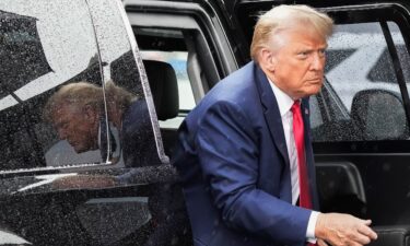 Former President Donald Trump arrives to board his plane at Ronald Reagan Washington National Airport on August 3 in Arlington