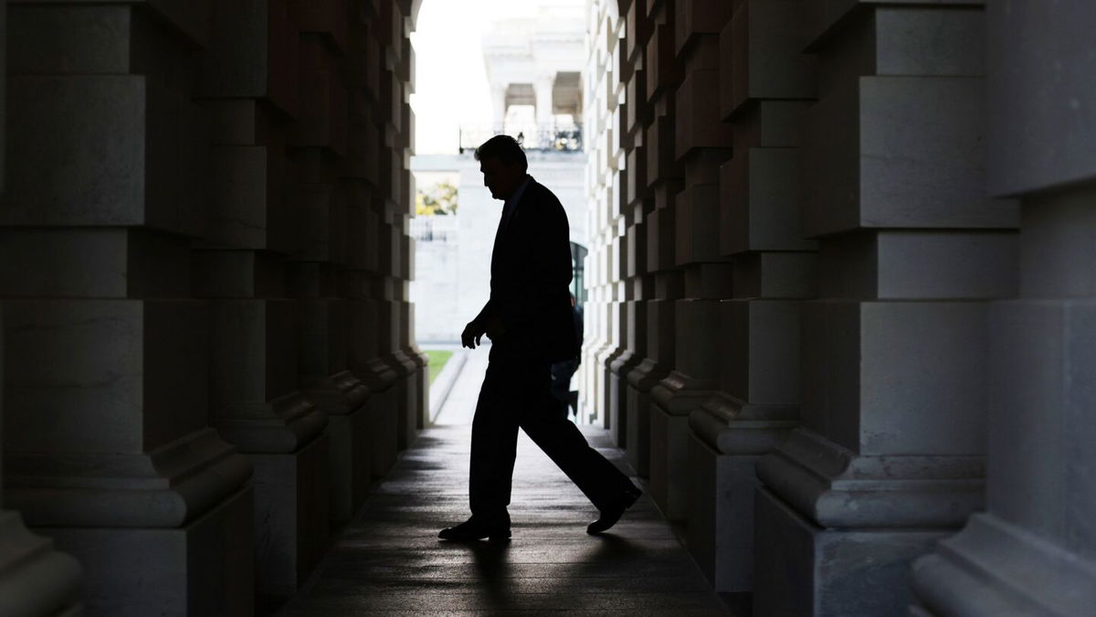 <i>Alex Wong/Getty Images</i><br/>Sen. Joe Manchin leaves the U.S. Capitol after a cloture vote September 27