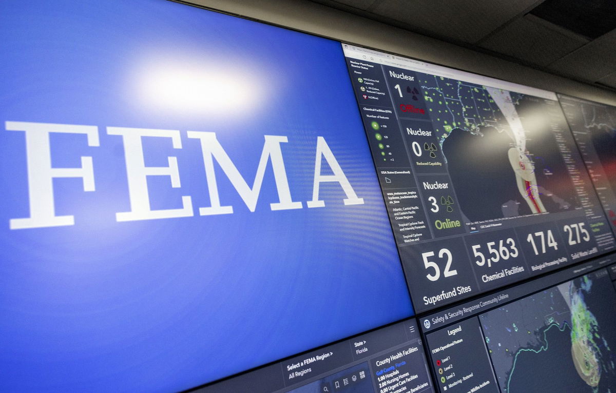 <i>Kevin Dietsch/Getty Images</i><br/>Screens display information on Hurricane Ian inside the National Response Coordination Center at FEMA headquarters in September 2022.