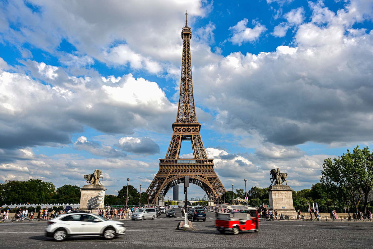 <i>Miguel Medina/AFP/Getty Images</i><br/>Cars drive past the Eiffel Tower in Paris on August 16