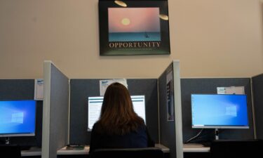 An attendee fills out job applications at a Novant Health Career Fair at NC Works in Wilmington