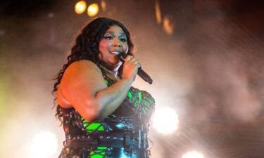 Lizzo performs on stage in July.