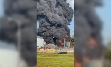 Smoke and flames are pictured rising from a refinery storage tank in Garyville