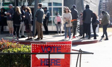 Voters line up at the Metropolitan Library to cast their ballots in the runoff election for the Senate position