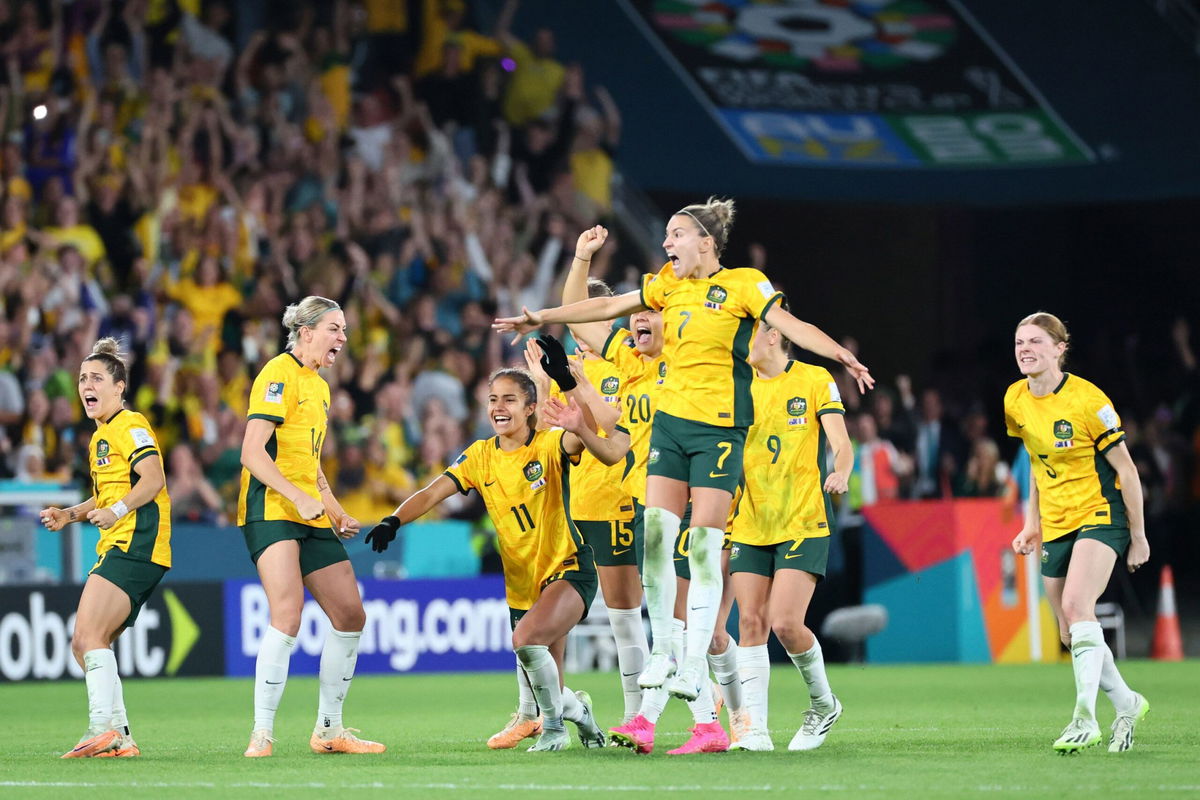 <i>Tertius Pickard/AP</i><br/>Australia's players celebrate winning on penalties in the Women's World Cup.